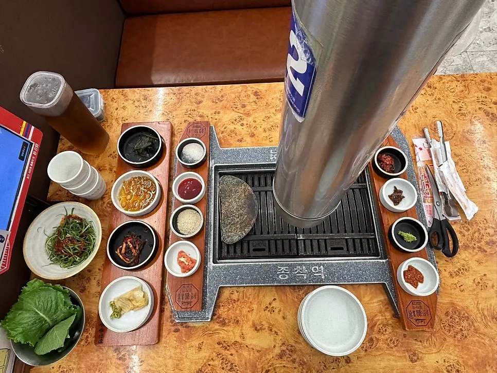 Table set with salted pollock roe, aged kimchi, and other basic side dishes
