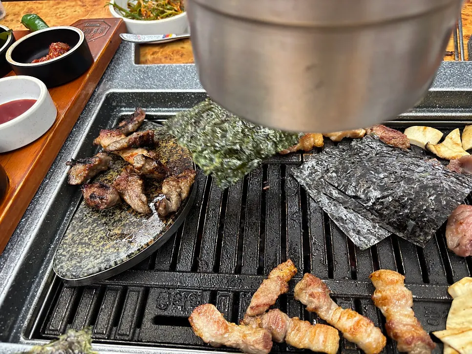 Table with grilled meat and basic side dishes together