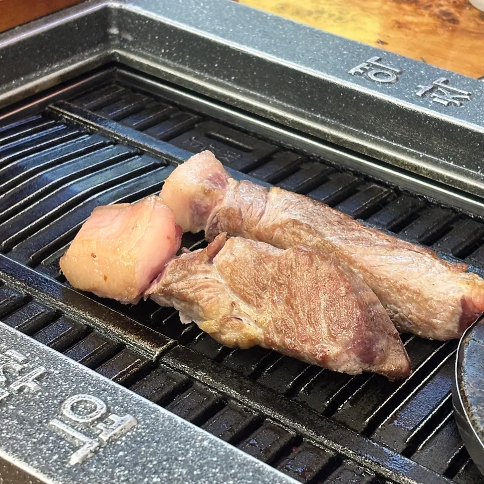 Thick pre-seared Korean pork served at the table