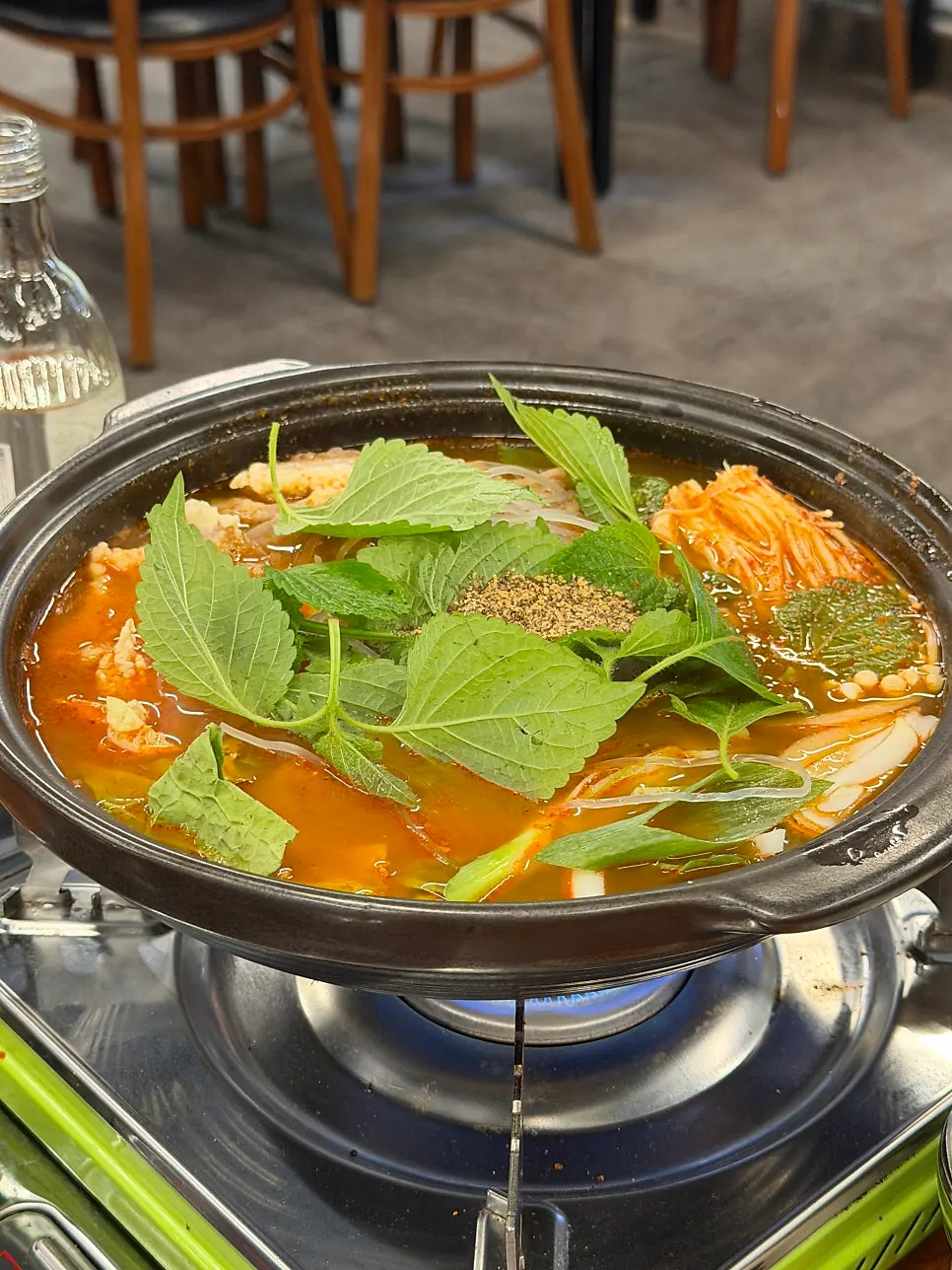 A side plate of green onion kimchi
