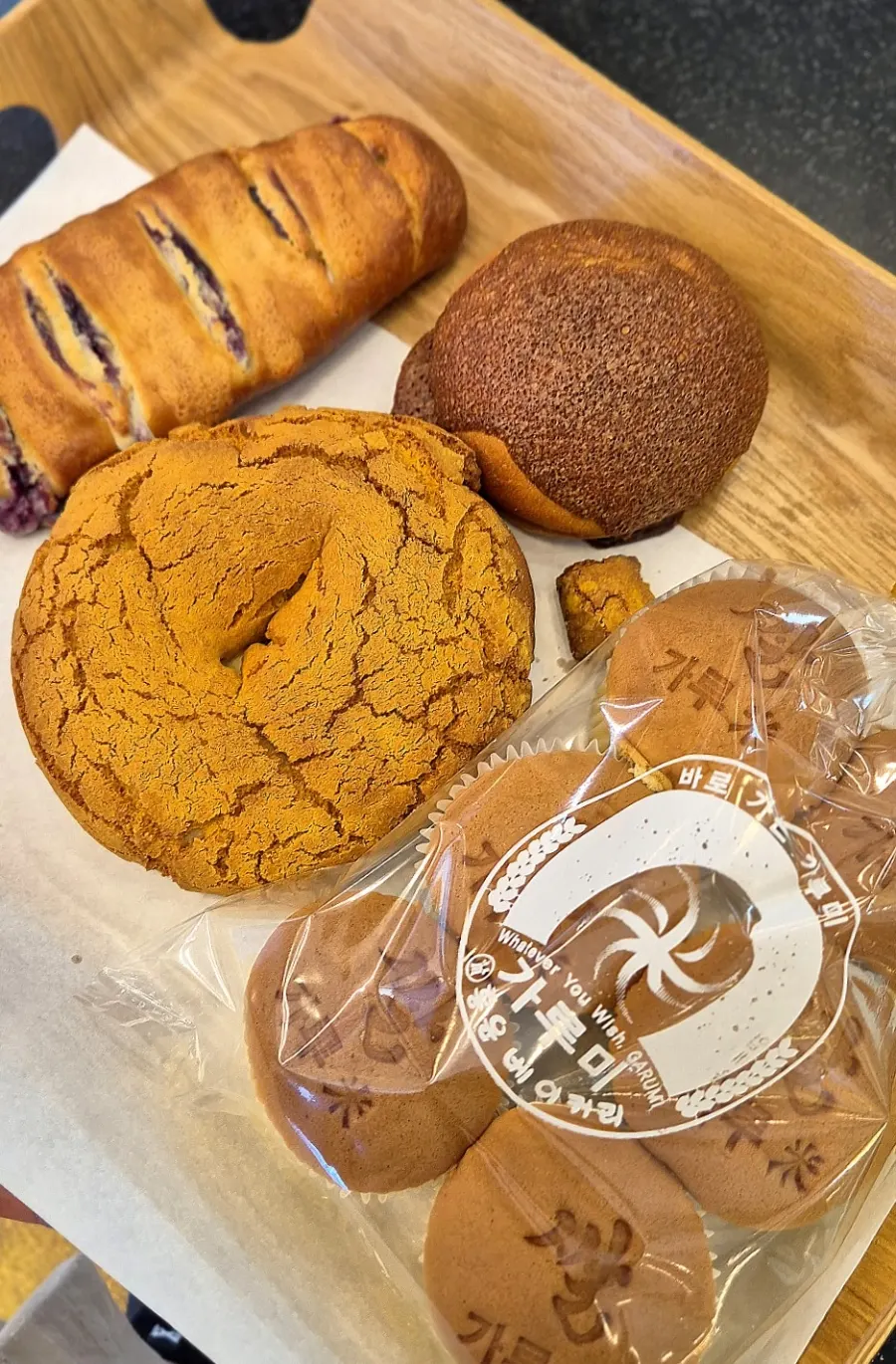 Customers choosing from assorted breads