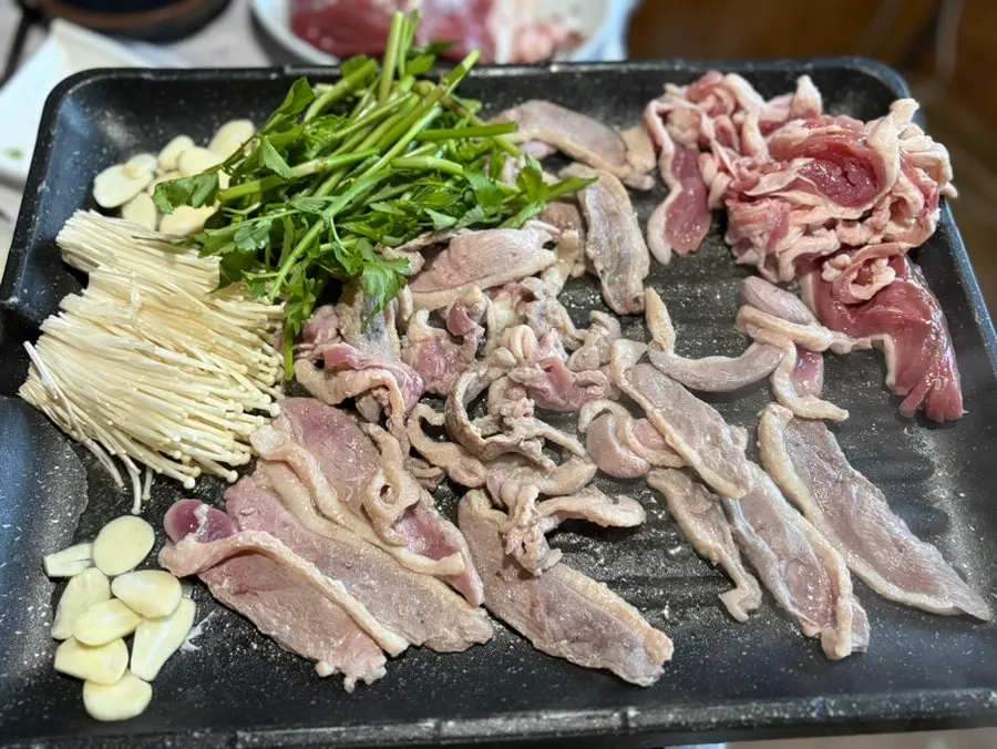 Duck grilling on the barbecue plate