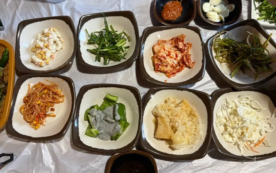 Complimentary side dish spread at Gunsan Jumulreok