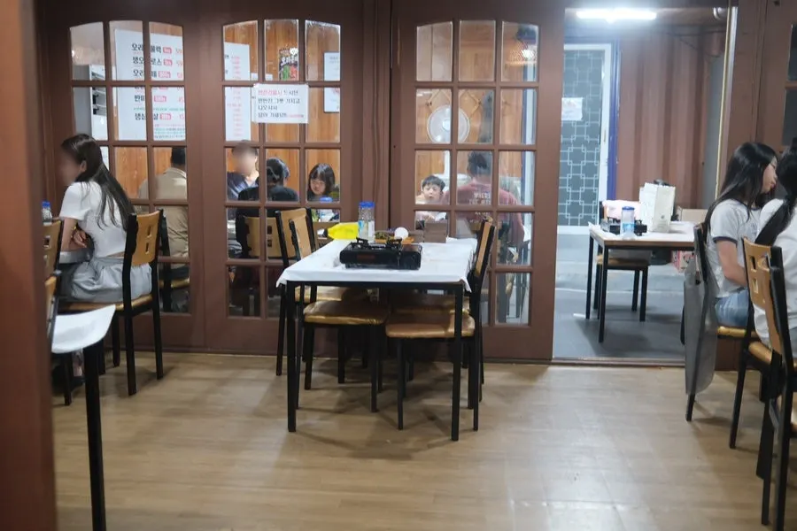 Meal menu board listing naengmyeon and fried rice
