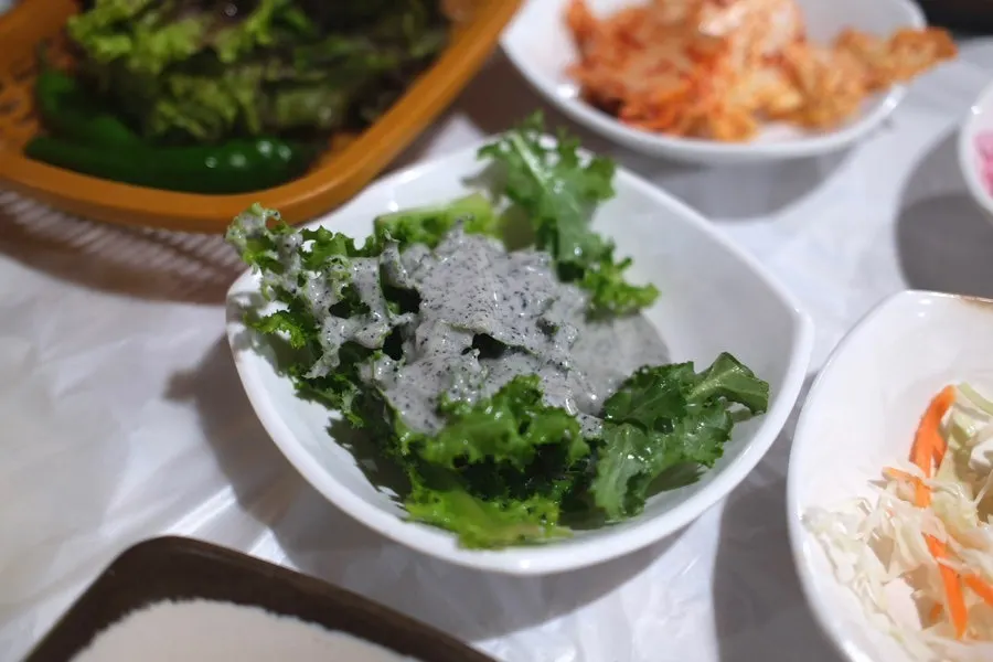 A spread of basic side dishes served with the duck meat
