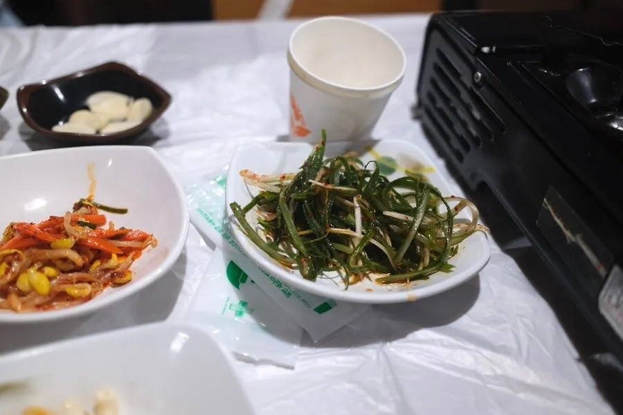 Kimchi and pickled onions among the side dishes