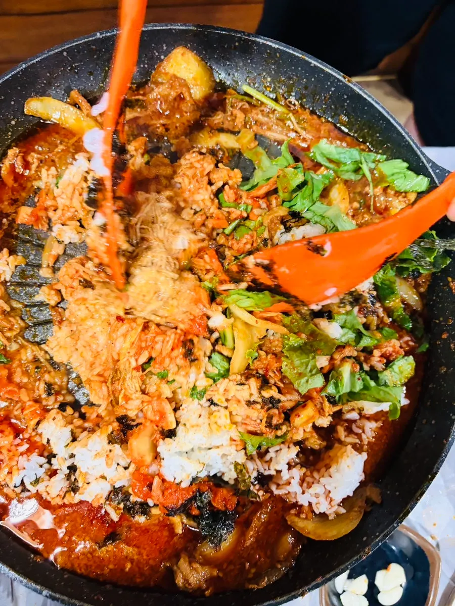 Self-fried rice ingredients placed on the griddle