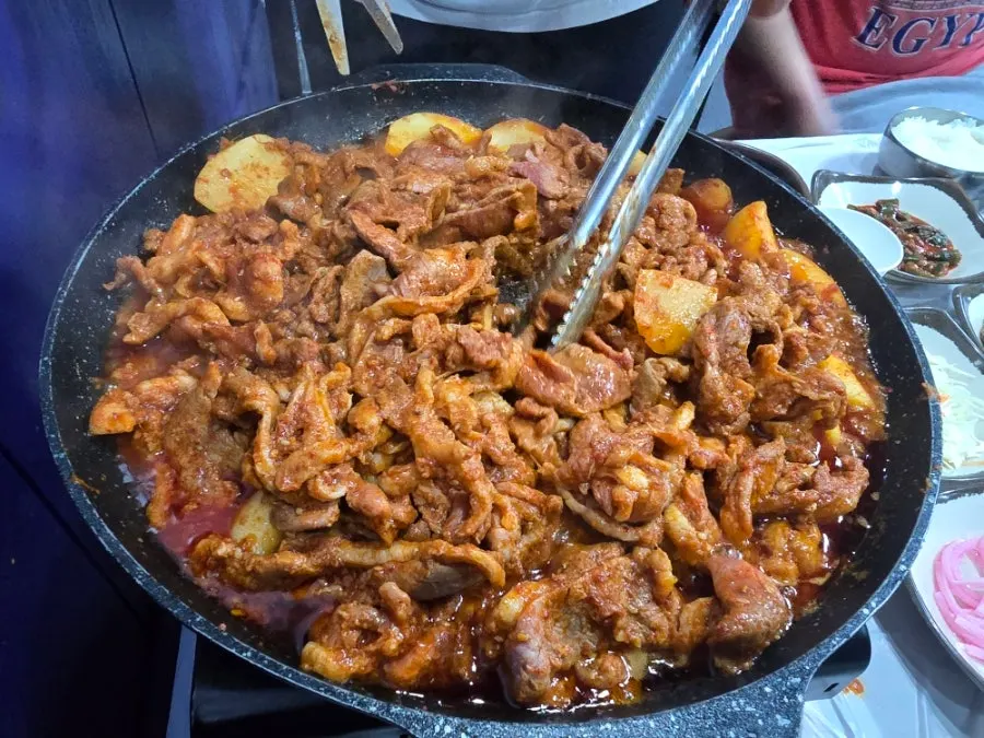 Sauce-coated duck meat and potatoes