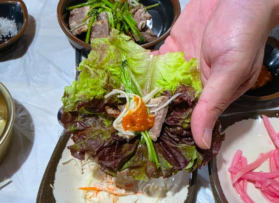 Lettuce wrap with duck roast and minari