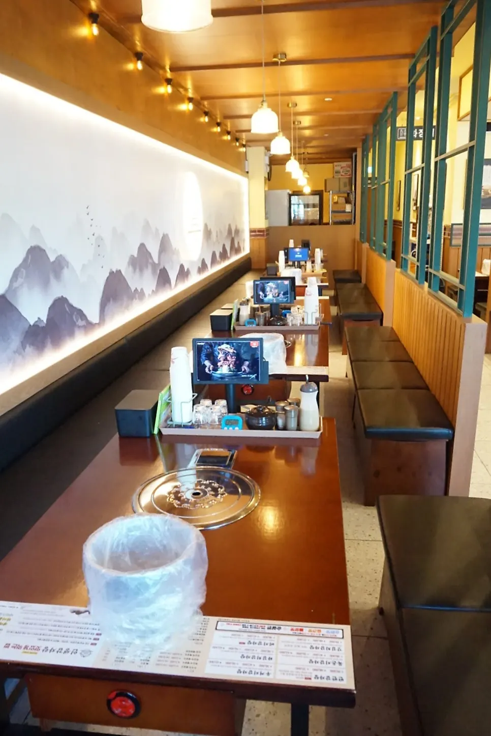 Seating inside the restaurant with wide table spacing