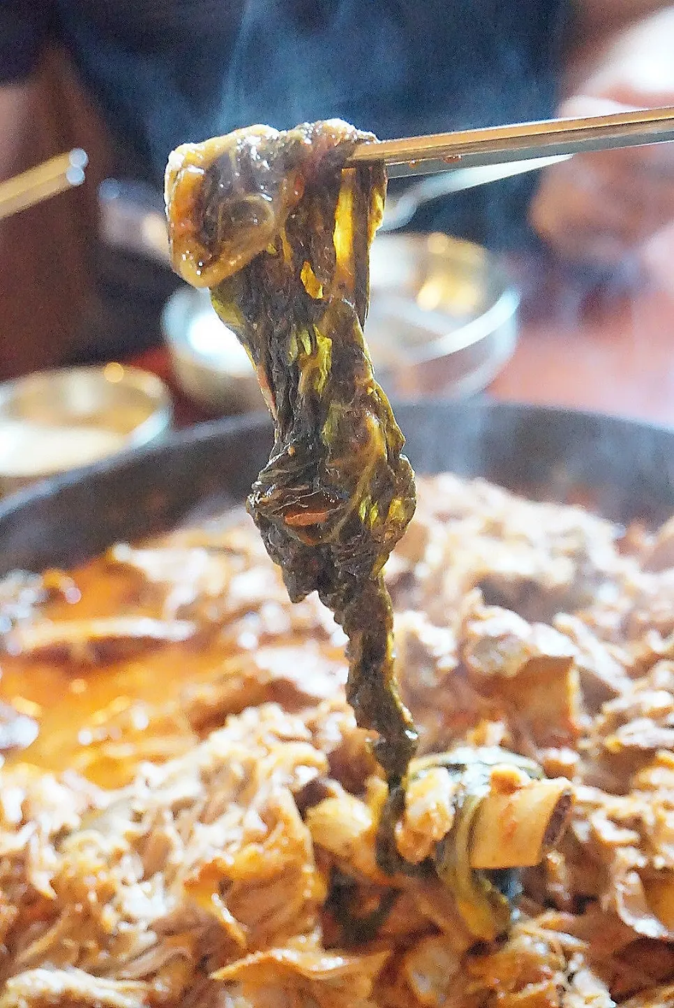 Pot of gamjatang loaded with ugeoji greens