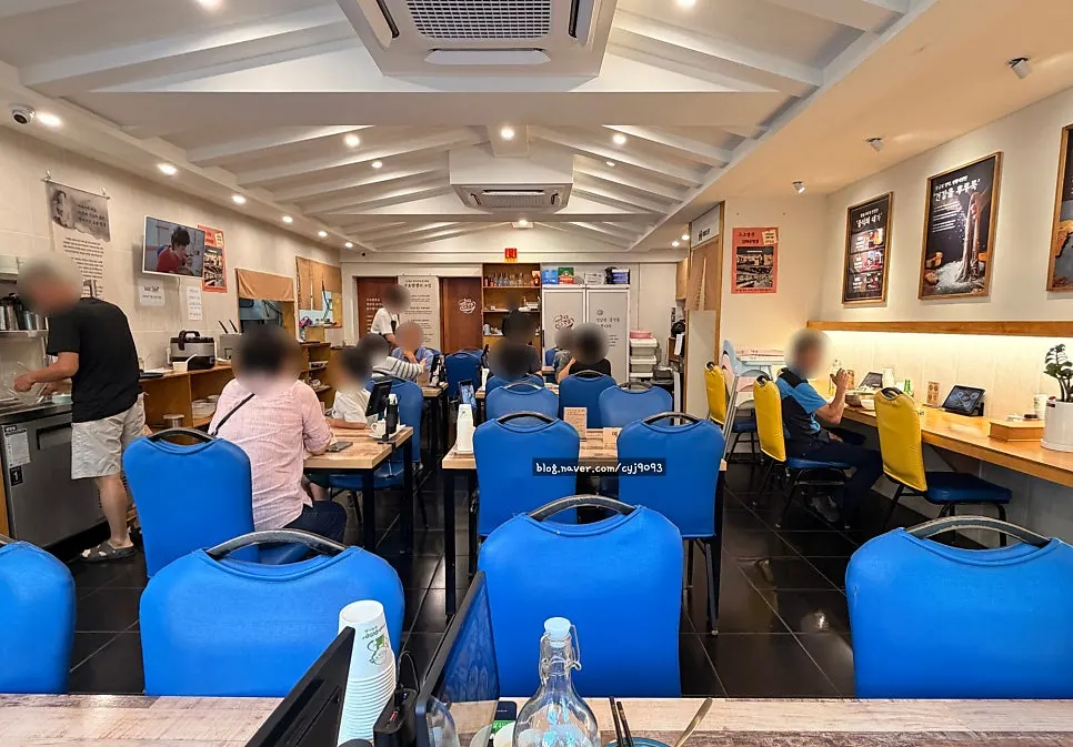 Interior with large windows and widely spaced tables