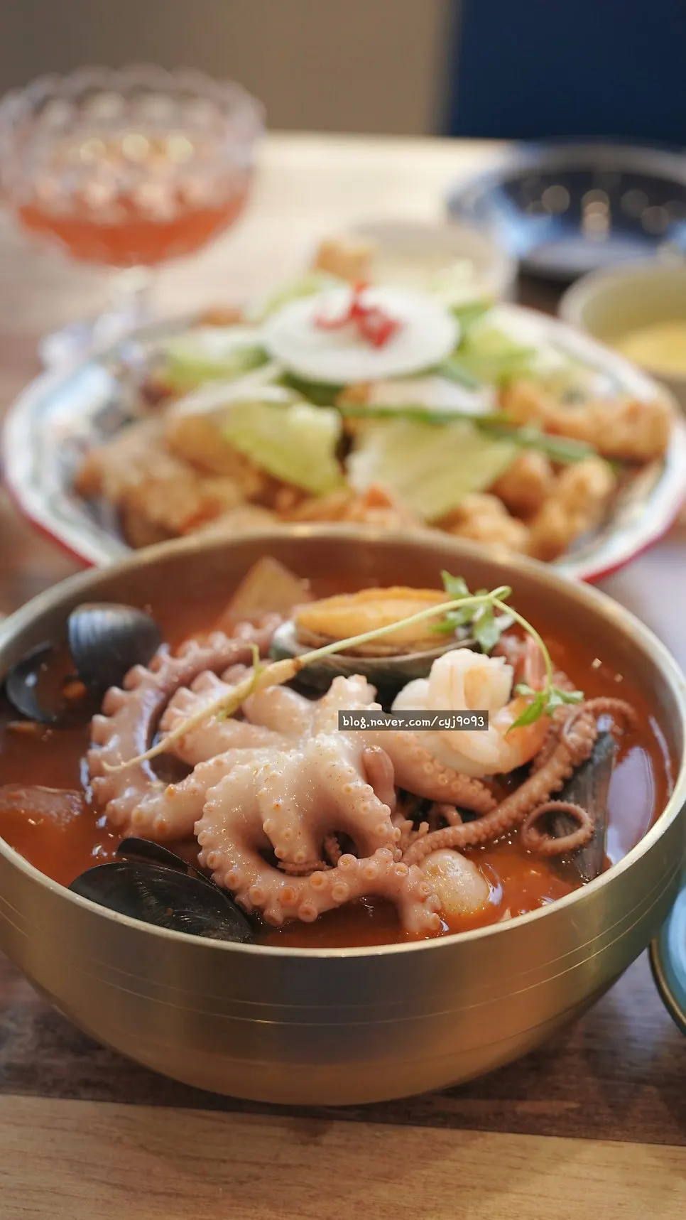 Octopus-abalone jjambbong topped with octopus, abalone, and fresh ginseng