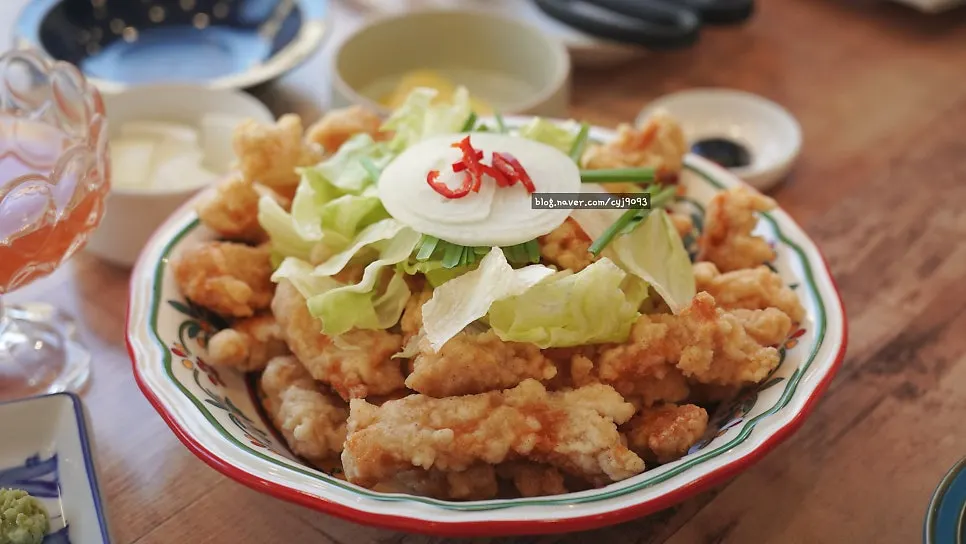 Tangsuyuk served with sauce, soy sauce, and wasabi