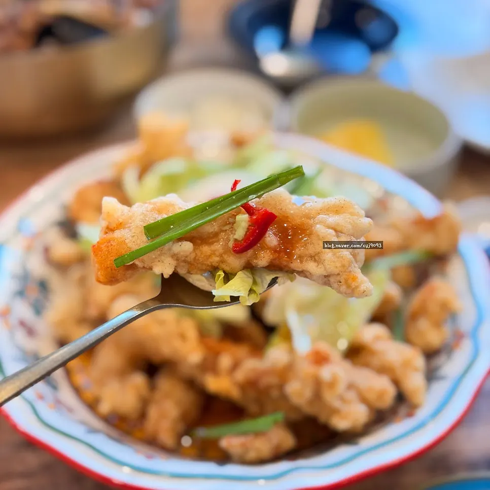 A piece of tangsuyuk topped with wasabi