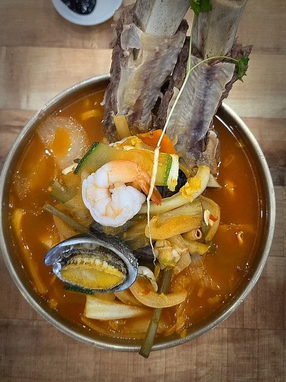 Jjambbong topped with ganalbi short rib and abalone
