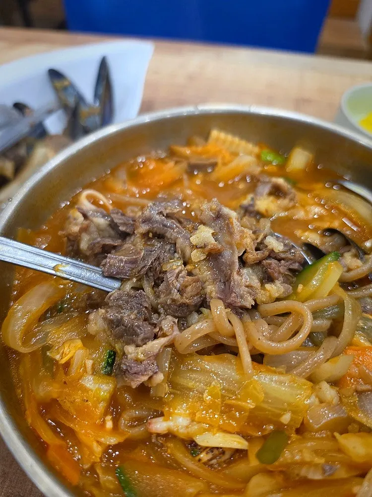 Seafood and vegetables inside the ganalbi abalone jjambbong