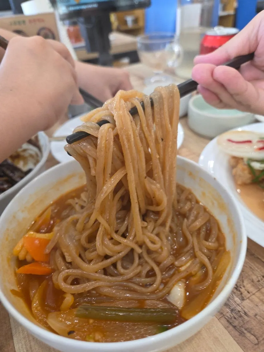 Brownish chaga mushroom noodles at Gupo Jjambbong