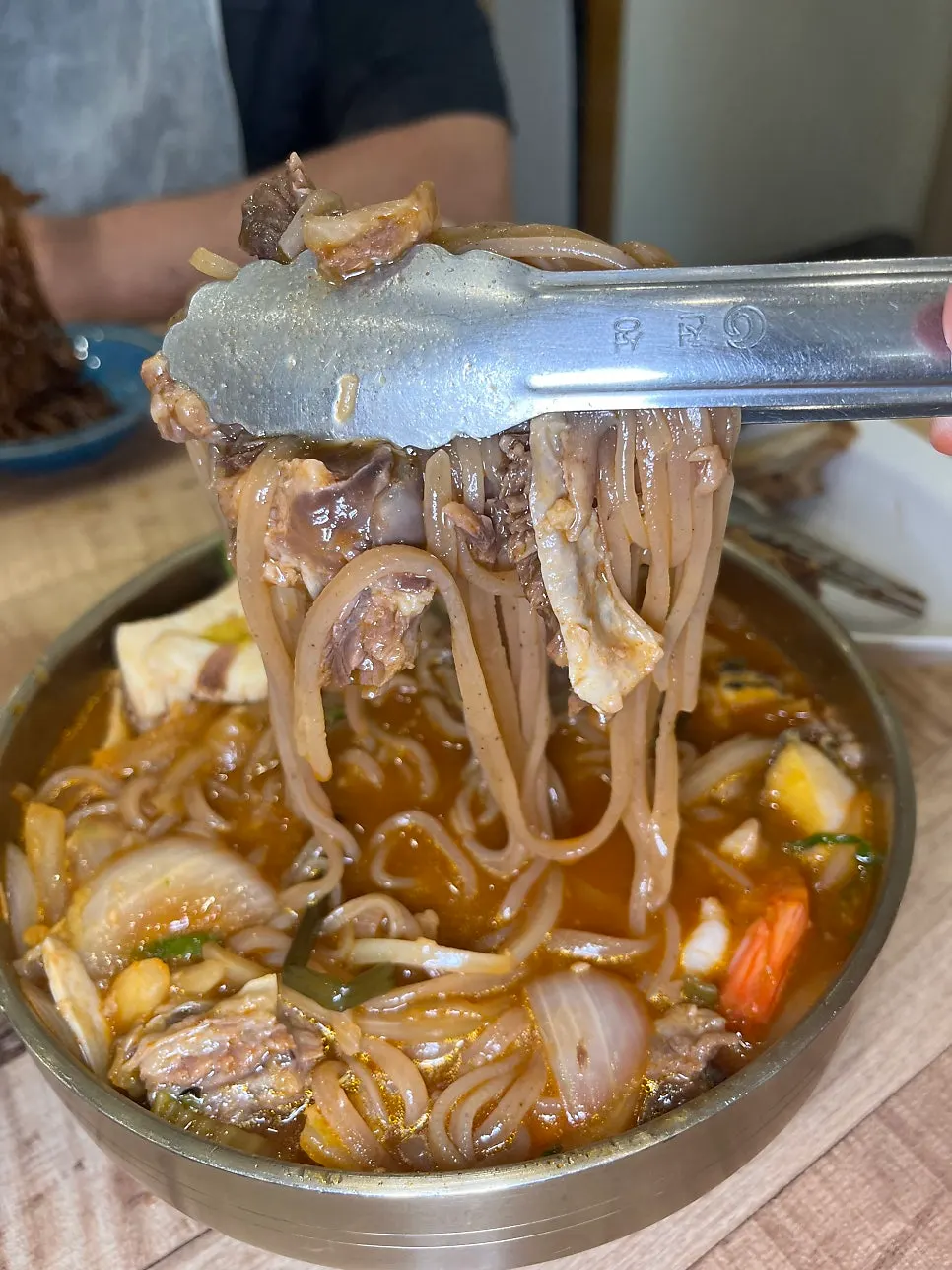 Abalone jjambbong topped with two rib pieces