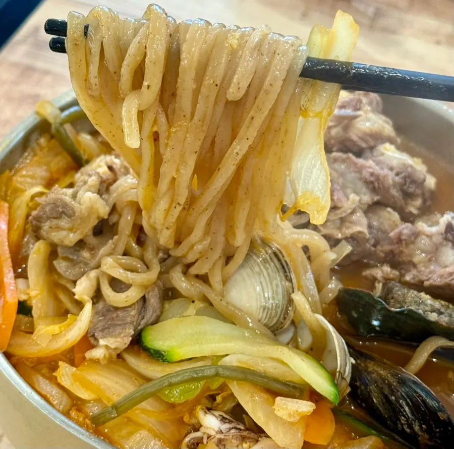 Bowl of jjambbong topped with rib meat
