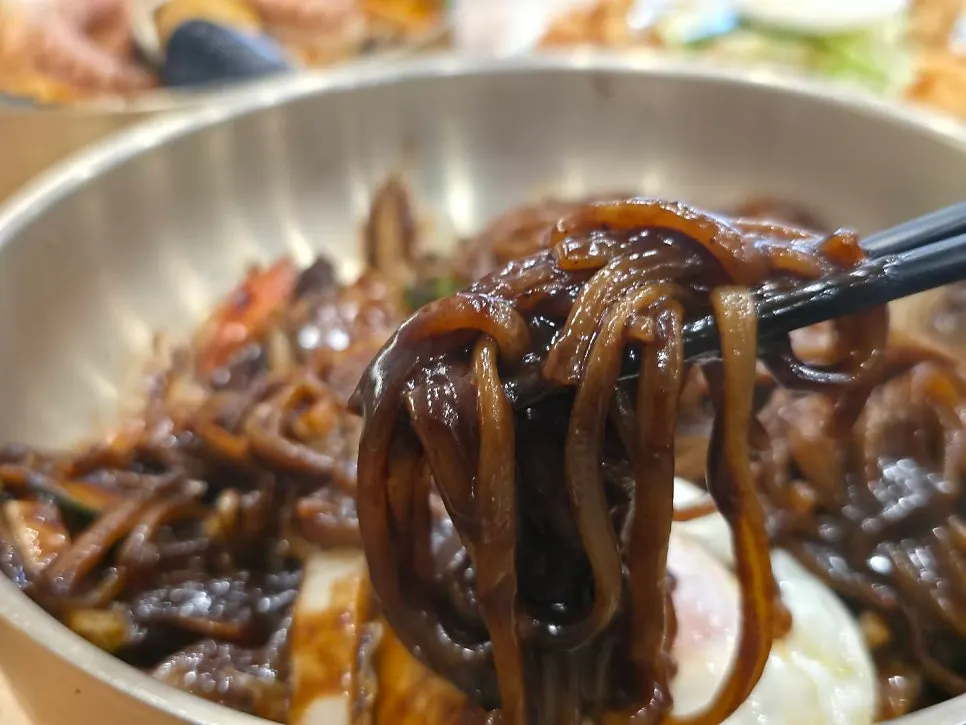 Jjajangmyeon topped with a fried egg