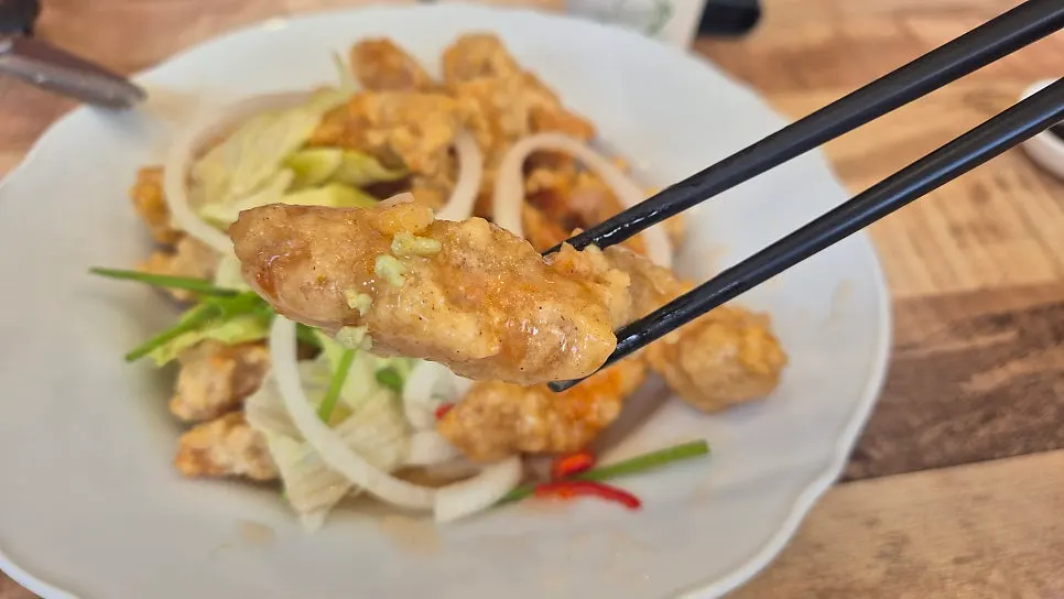 A piece of tangsuyuk topped with wasabi