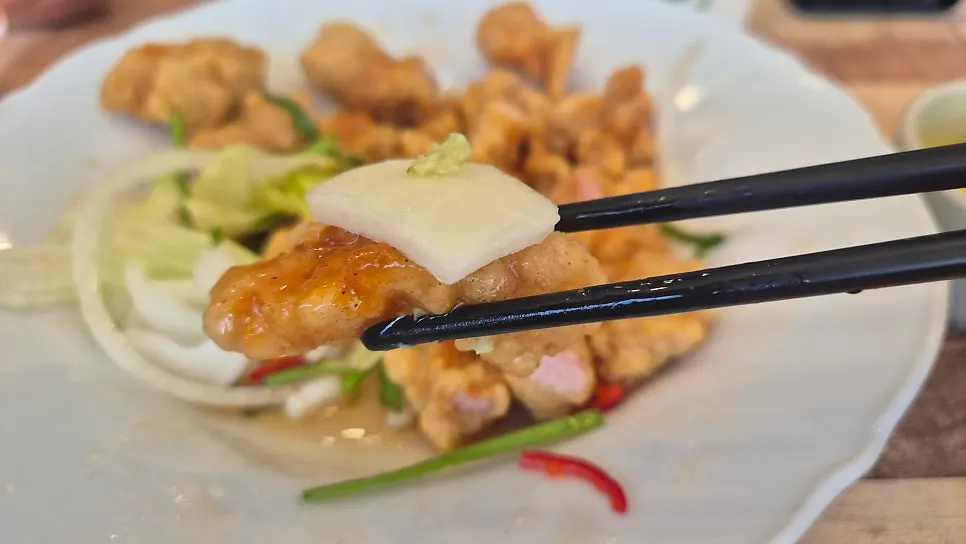 Cross-section of tangsuyuk showing its crispy batter