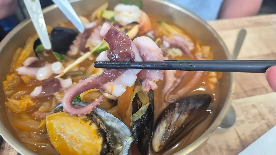 Octopus abalone jjambbong topped with octopus and abalone