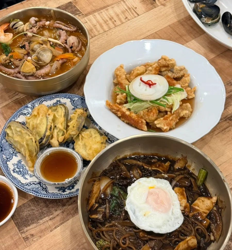 Full spread of seafood jjajang, octopus-abalone jjambbong, eggplant mandu and tangsuyuk