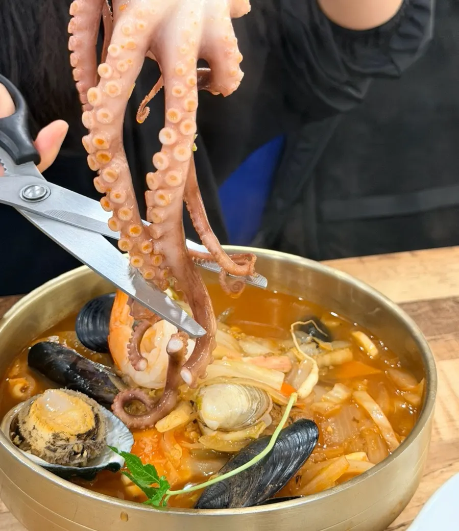 Whole octopus being cut into pieces