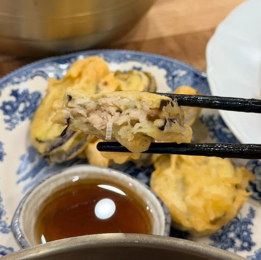 Eggplant mandu cut in half showing the filling