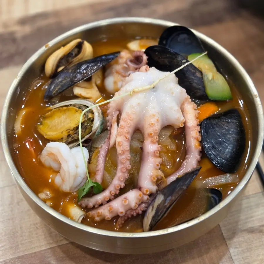 Octopus abalone jjambbong with a whole octopus and two abalones