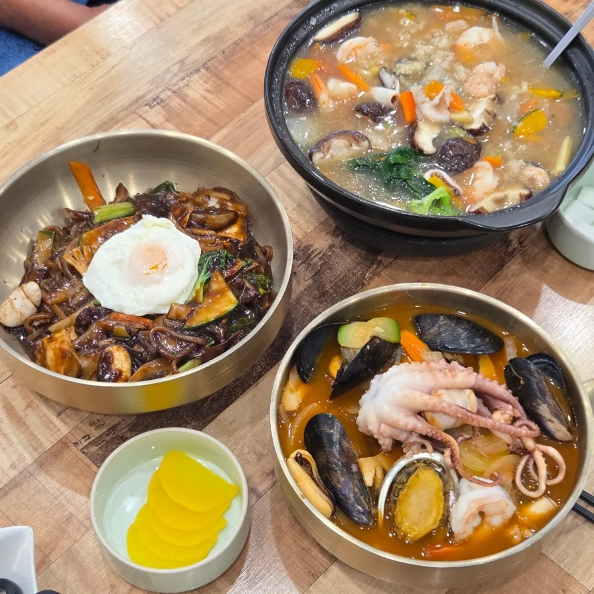 Octopus cut with scissors alongside jjambbong noodles