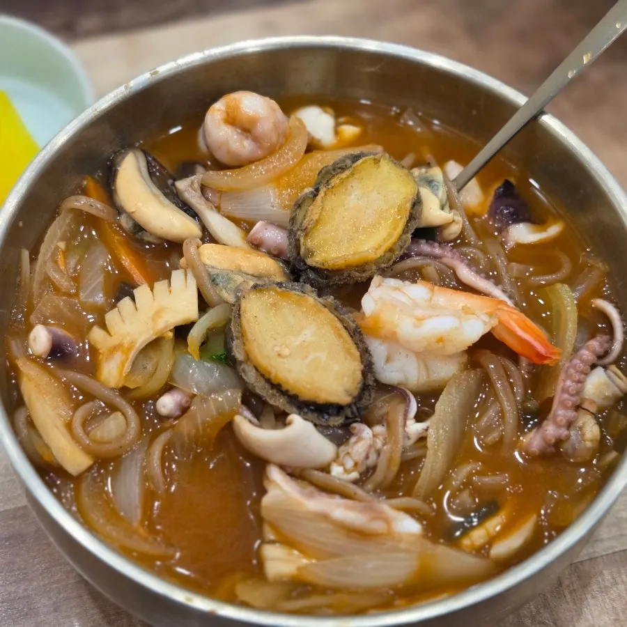 Bowl of octopus abalone jjambbong with shells removed