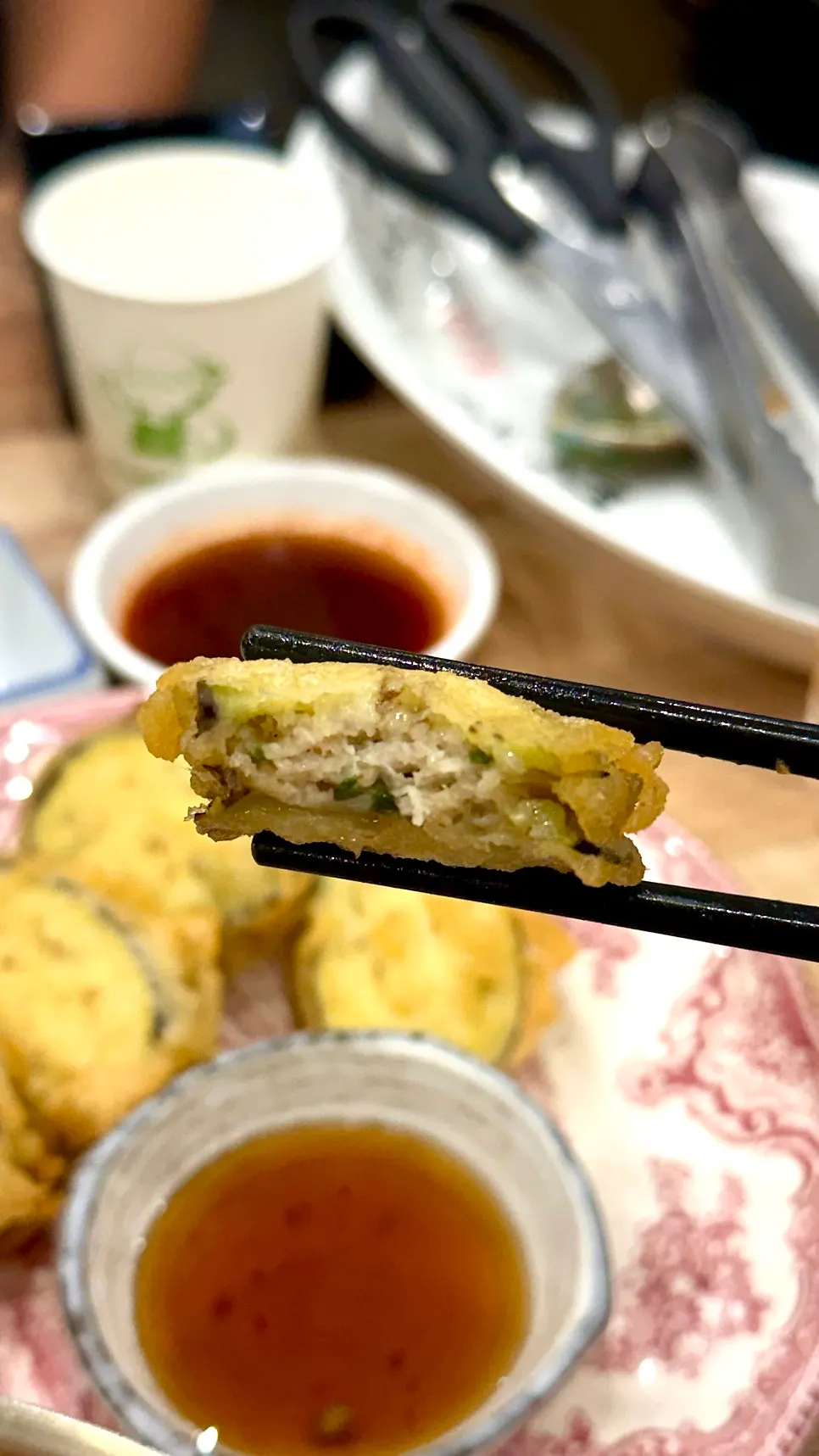 Cross-section of eggplant mandu showing filling inside eggplant slices