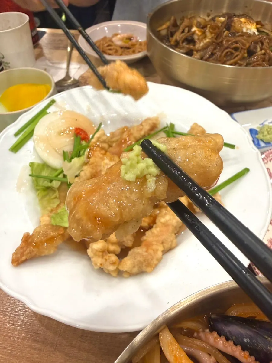 Plate of tangsuyuk with sauce poured on top
