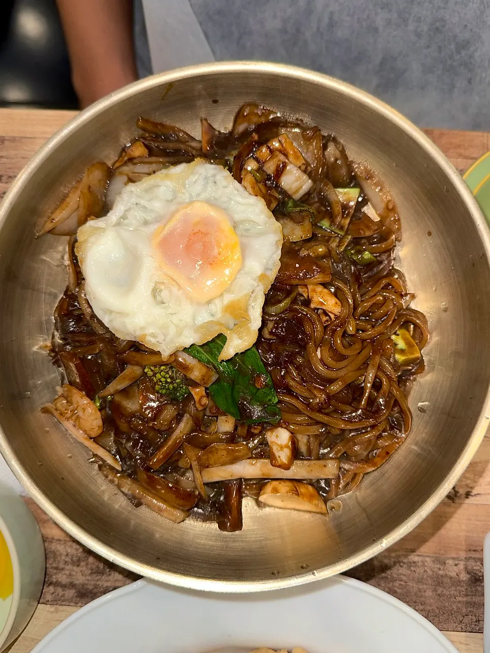 Seafood platter jjajang topped with a fried egg