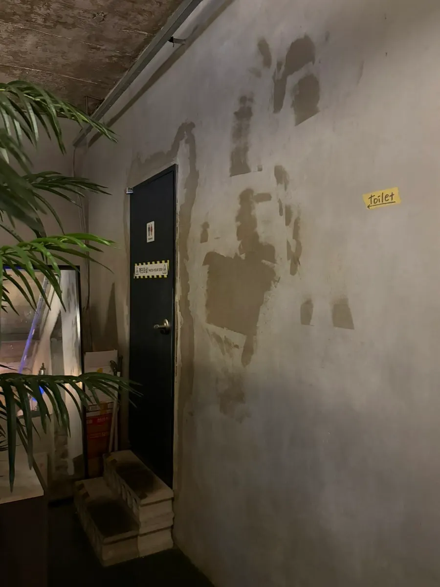 Entrance to the unisex restroom inside Muje