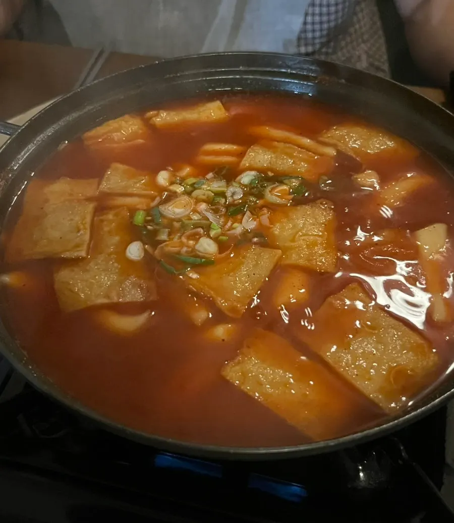 Soupy tteokbokki served with a gas burner