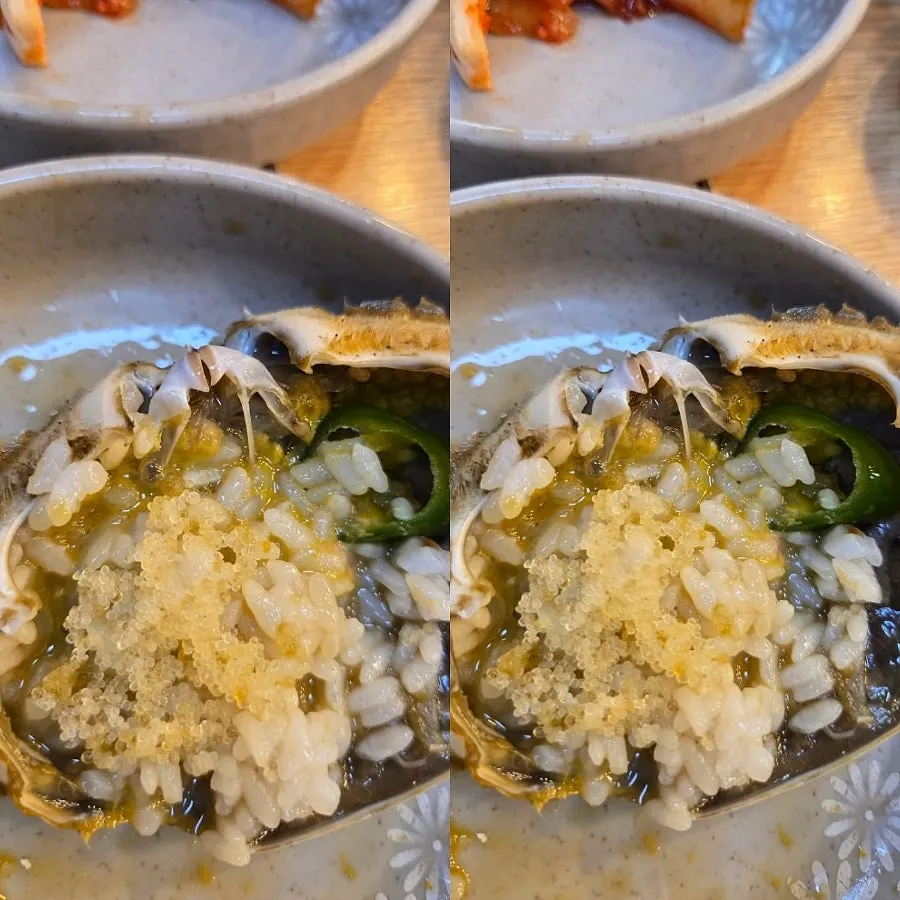 A bowl of rice topped with picked crab meat