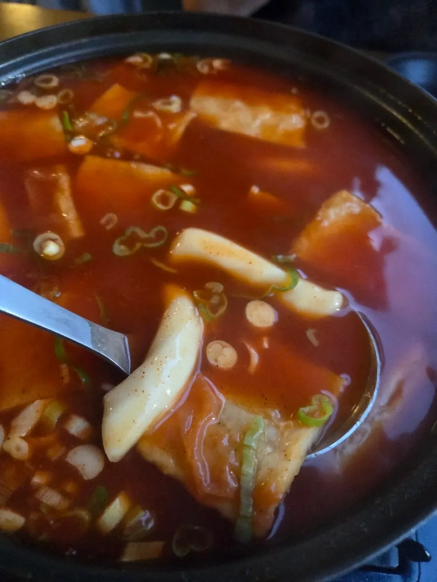 Broth-soaked noodles and chewy rice cakes