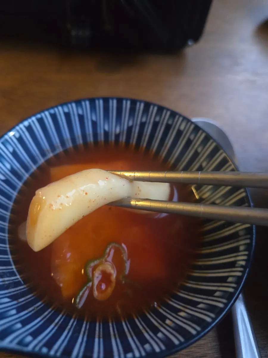 A bite of spicy rice cake soup