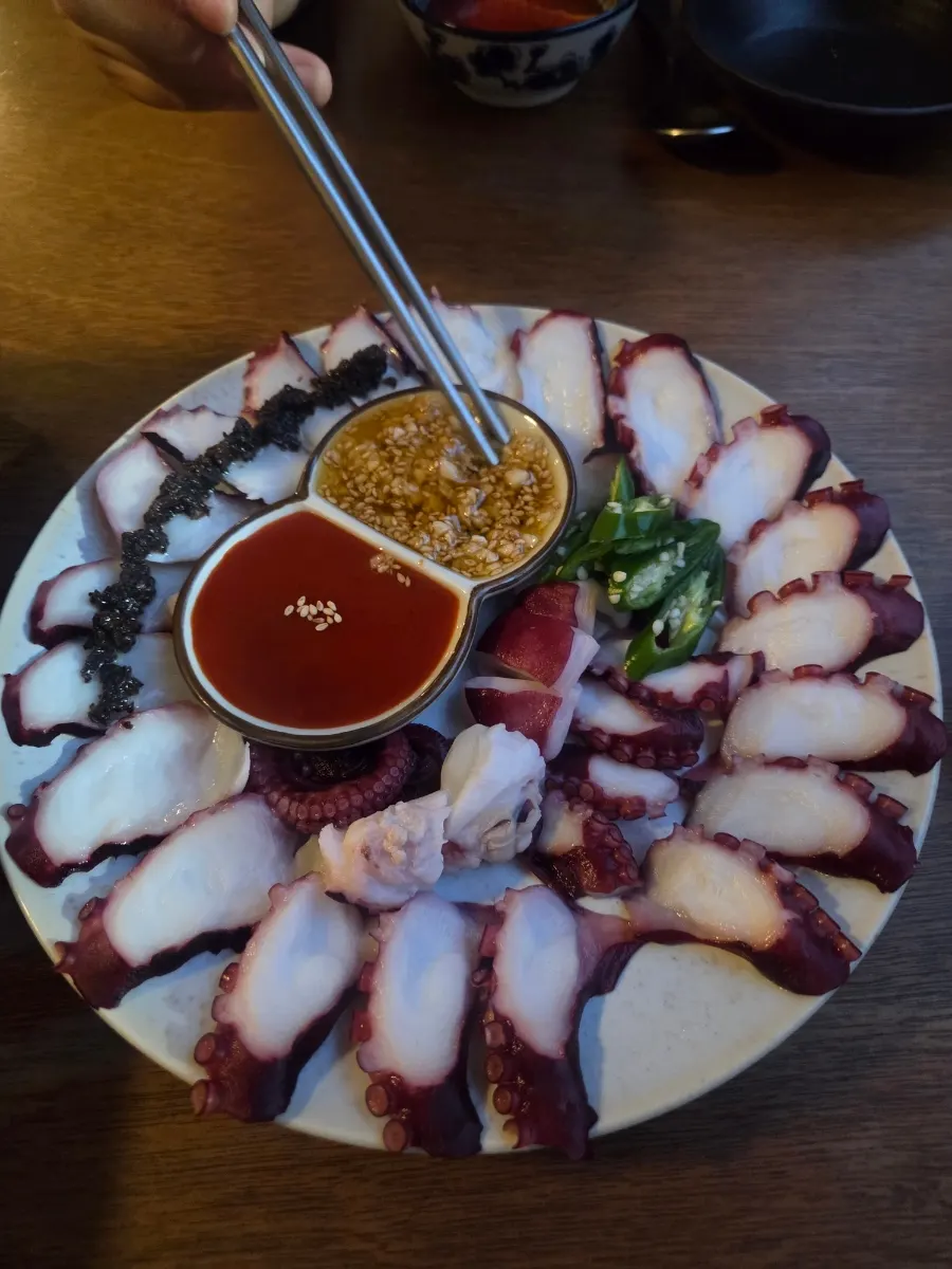 Rice cake soup and boiled octopus served together
