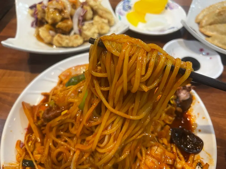 Stir-fried jjamppong with seafood and bean sprouts