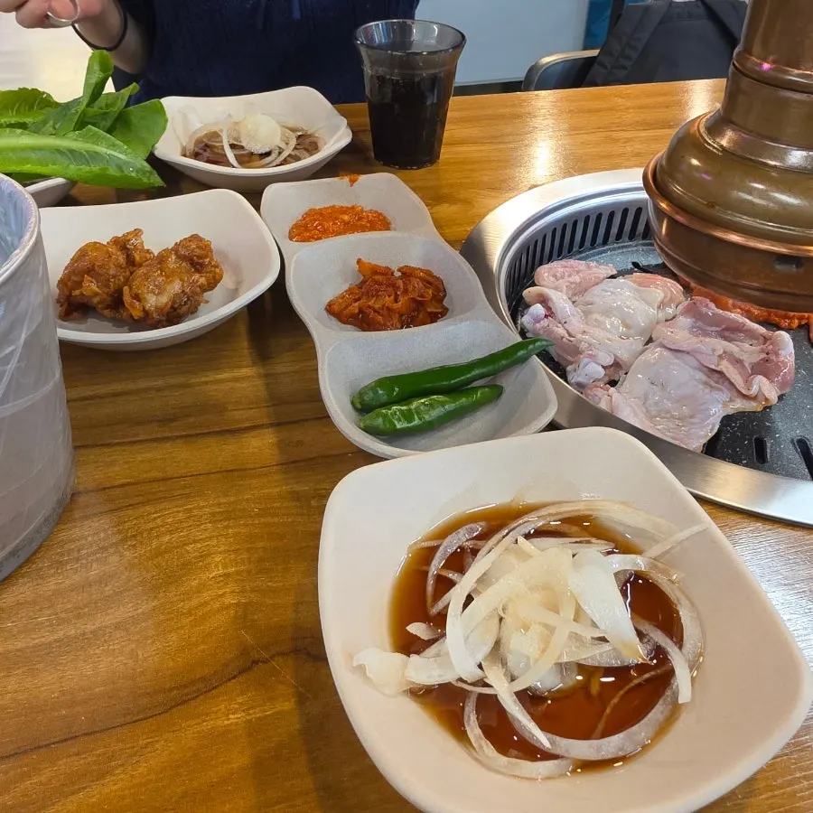 A full table set up with meat and side dishes