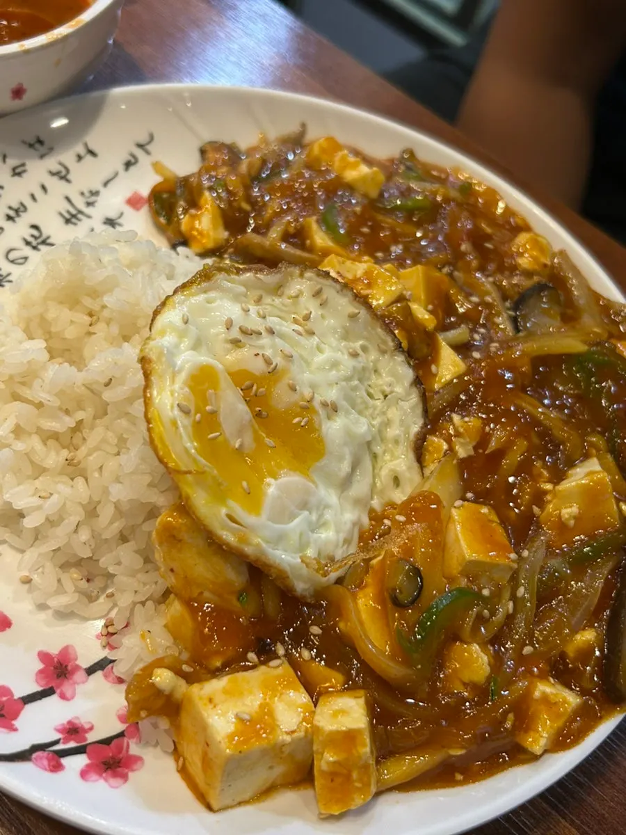 Close-up of a single piece of chilli sweet and sour pork