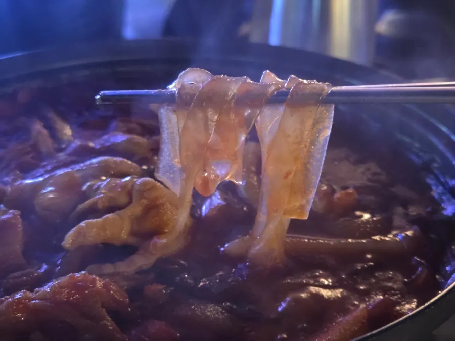 Boneless chicken feet in red broth