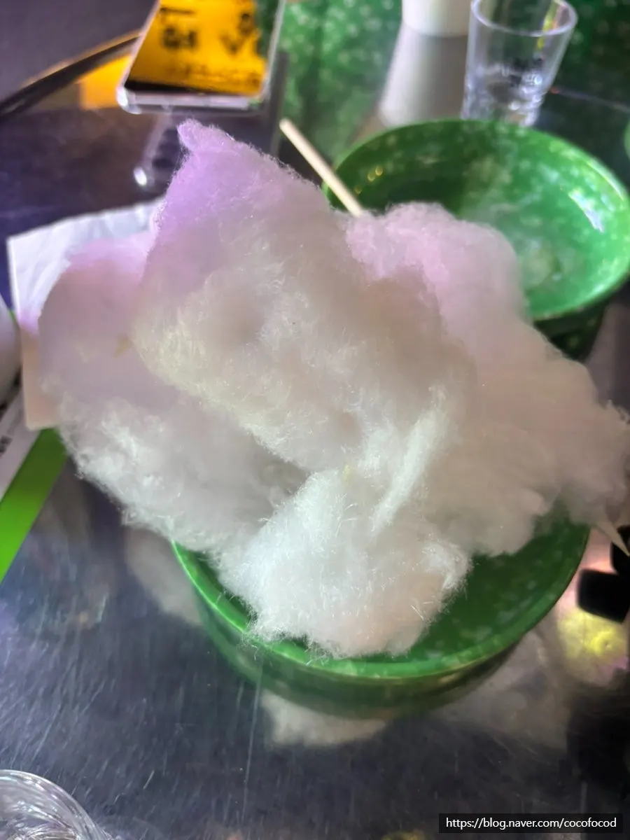 Hands making cotton candy