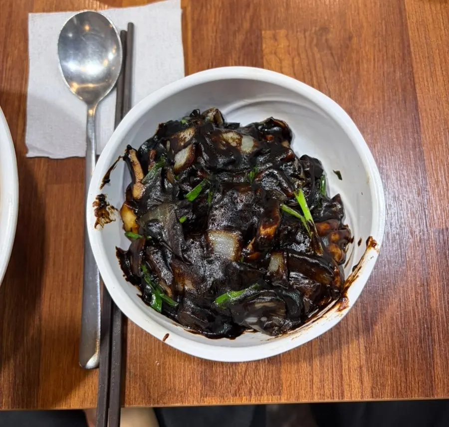 Ganjjajang topped with a fried egg
