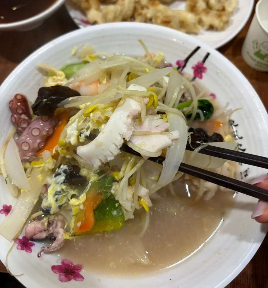 A bowl of samseon udon packed with seafood